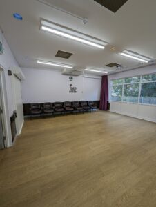 Pictures of the large hall, lilac walls and aubergine curtains